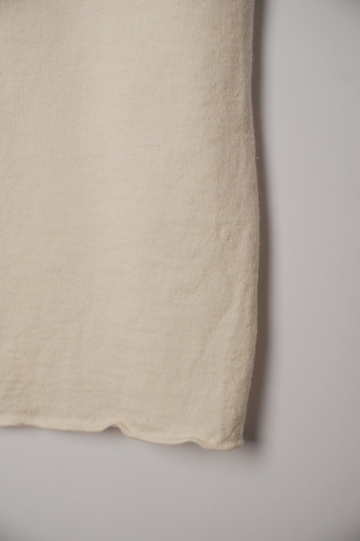 Studio Nicholson Sleeveless Merino Wool Vest with Asymmetric Slit
