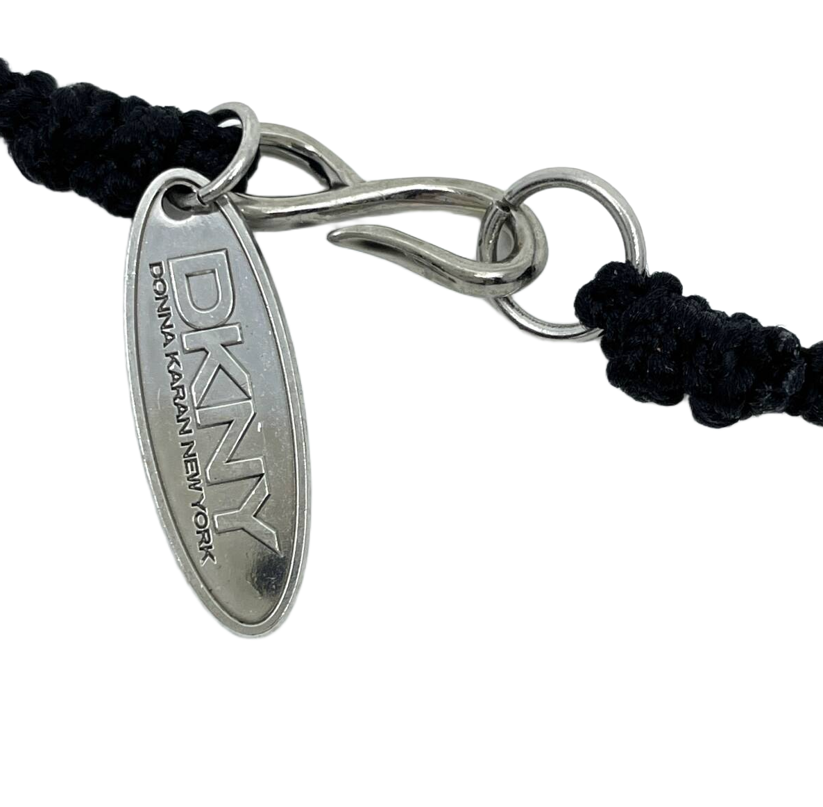 DKNY Donna Karan New York long necklace pendant in black with a heart motif