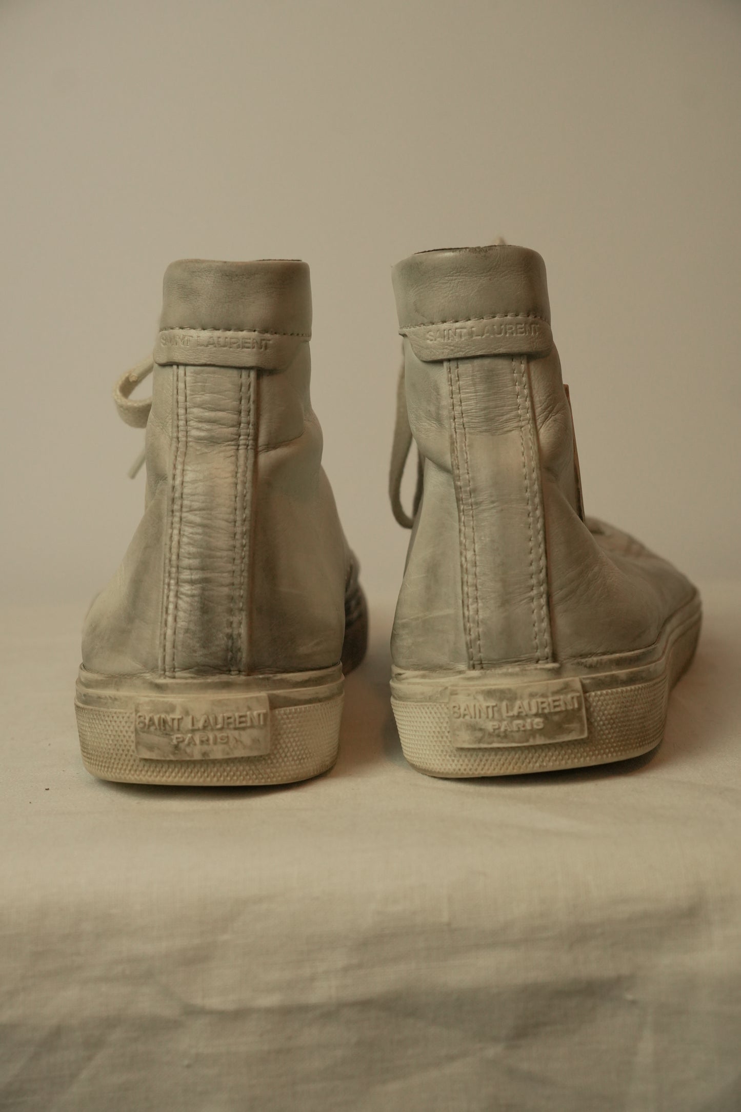 Saint Laurent High Top Distressed Leather Sneakers